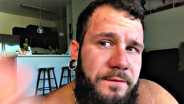 Bearded jock rides huge dildo while masturbating