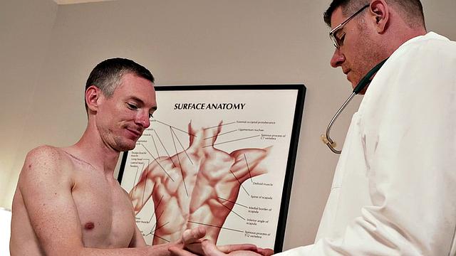 Tall doctor seducing short patient