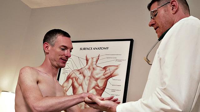 Tall doctor seducing short patient