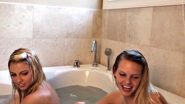 Cute girl goes lesbo in the tub and plays