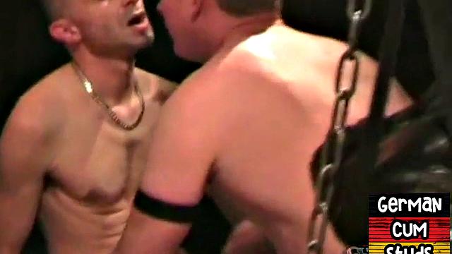 Masked German bottom fucked in sling orgy till cum