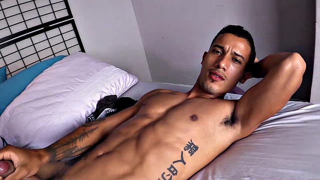 Already stripped to his underwear, it isn't long before this Latino is naked on a bed and working up a stiff one.