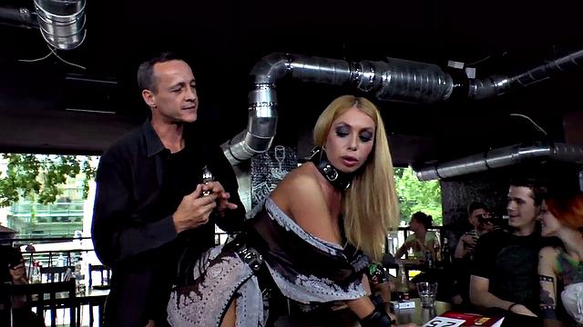 Hot blonde MILF in high heels takes on multiple cocks in public orgy with butt plug action