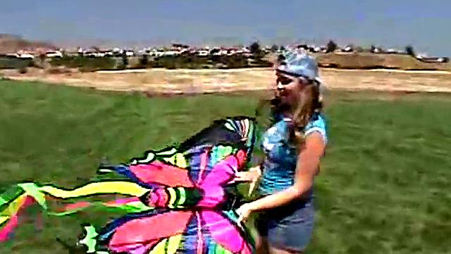 Little April sucking on a popsicle