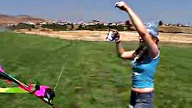 Little April sucking on a popsicle