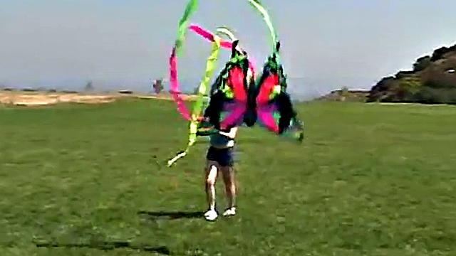 Little April sucking on a popsicle