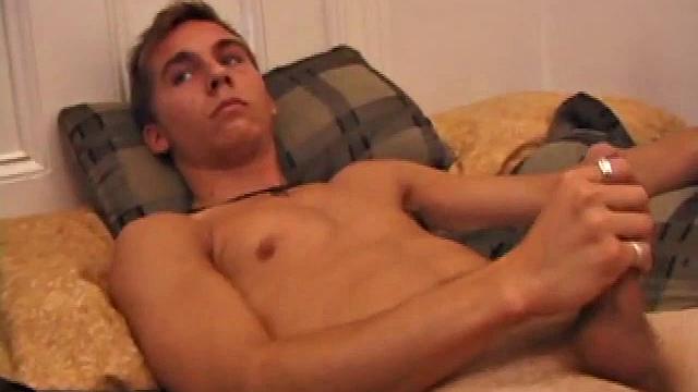 After storing his load for about a week, Brock is back to stroke one out for us. He makes himself at home on the bed, strips naked, and starts working his dick.