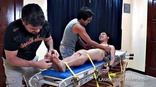 Mike and Ricky caught Vahn stealing their diamonds, but not before he hid them. So knowing how ticklish this cute Asian twink is, they strap him down for interrogation.