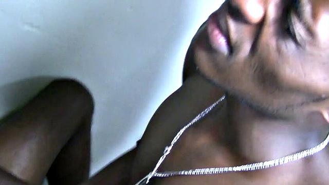 Watch skinny Nubian tugging on partner's shaft and taking his load