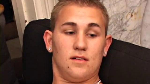 Adrian Knutts strips naked and works the remote control as he strokes his cock to the porn video.