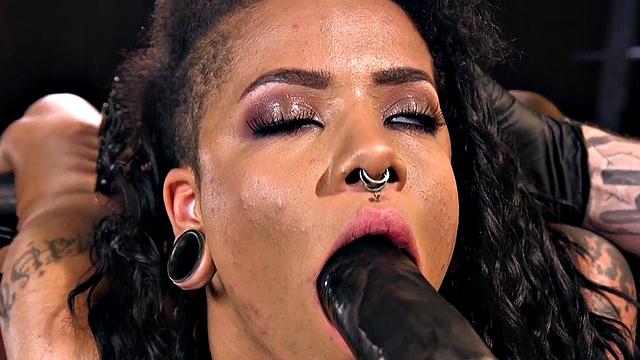 Bound subject toyed with dildo during punishment