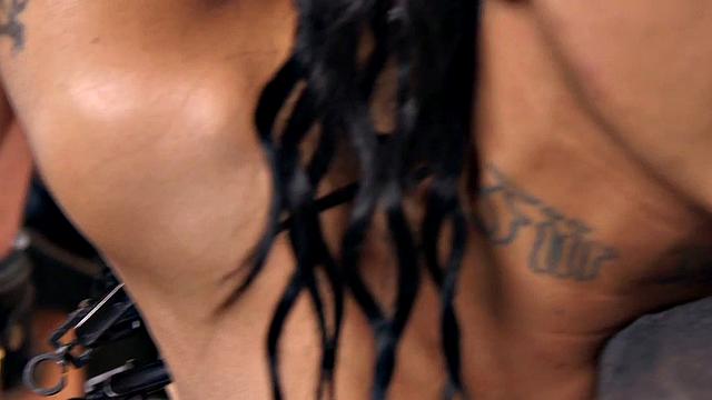 Bound subject toyed with dildo during punishment