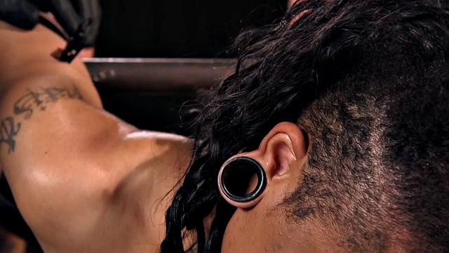 Bound subject toyed with dildo during punishment