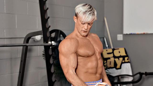 Eager athletic jock solo masturbating in gym until climax