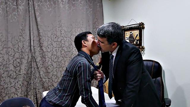 Asian twink barebacked by white business in office