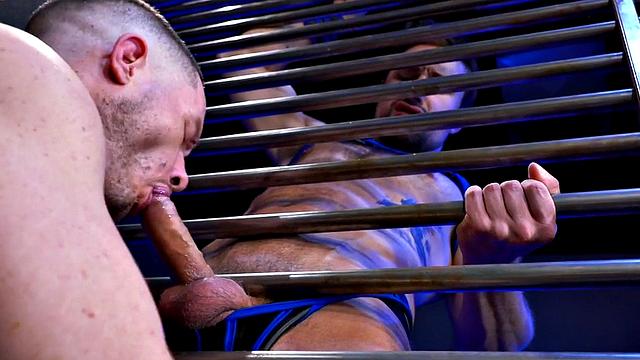 Fisting jock with gloved hands fists BF in harness