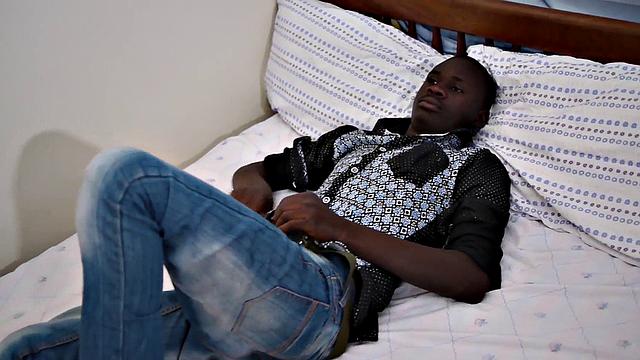 Real African twink jerks his sturdy black cock at home