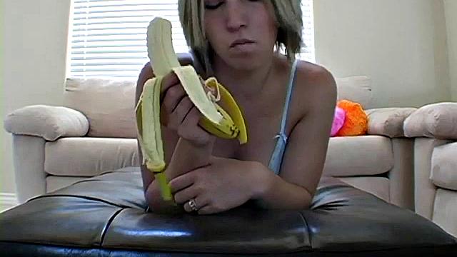 Teasing teen peels banana