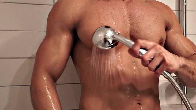 Masked athletic jock wanks cock in solo action