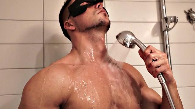 Masked athletic jock wanks cock in solo action