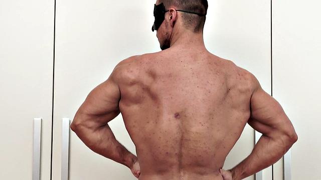 Masked athletic jock wanks cock in solo action