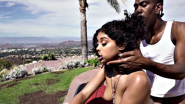 Curly-haired ebony teen with tattoos takes BBC deep in her throat & pussy outside