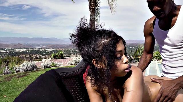 Curly-haired ebony teen with tattoos takes BBC deep in her throat & pussy outside