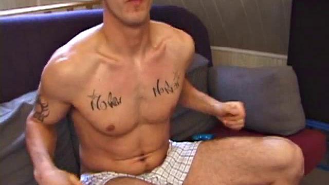 After work, Ryan cues up a porn video and begins stripping off his clothes. He's totally into himself and poses for the camera.