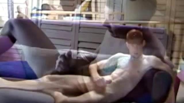 Shane and Tristian are talking about how horny the video is making them when they decide to relieve the pressure. Shane gets up and moves to the bed, while Tristian strokes his cock on the sofa.