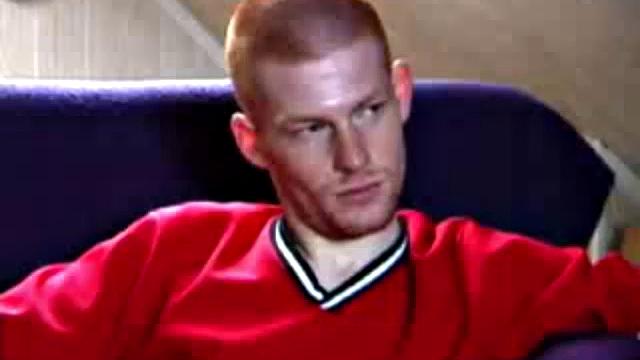 Shane and Tristian are talking about how horny the video is making them when they decide to relieve the pressure. Shane gets up and moves to the bed, while Tristian strokes his cock on the sofa.