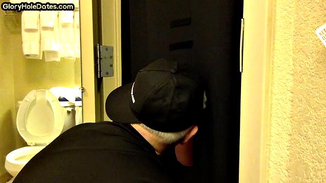 Gloryhole DILF sucks cock with eager mouth near toilet