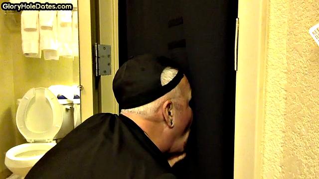 Gloryhole DILF sucks cock with eager mouth near toilet