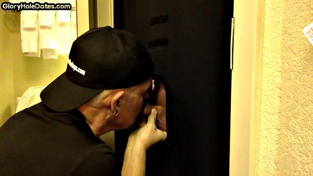 Gloryhole DILF sucks cock with eager mouth near toilet