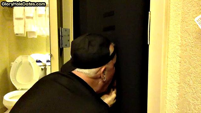 Gloryhole DILF sucks cock with eager mouth near toilet