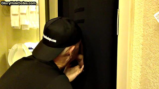 Gloryhole DILF sucks cock with eager mouth near toilet
