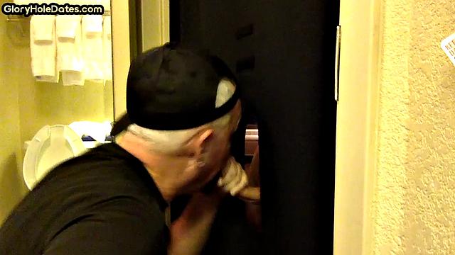 Gloryhole DILF sucks cock with eager mouth near toilet