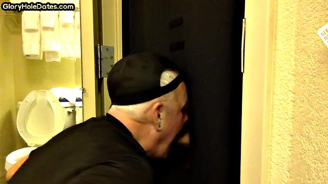 Gloryhole DILF sucks cock with eager mouth near toilet