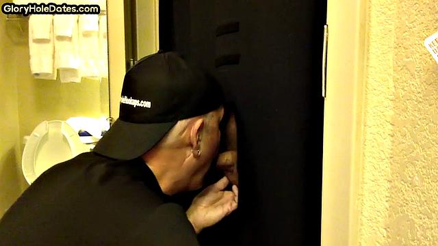 Gloryhole DILF sucks cock with eager mouth near toilet