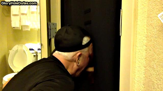 Gloryhole DILF sucks cock with eager mouth near toilet