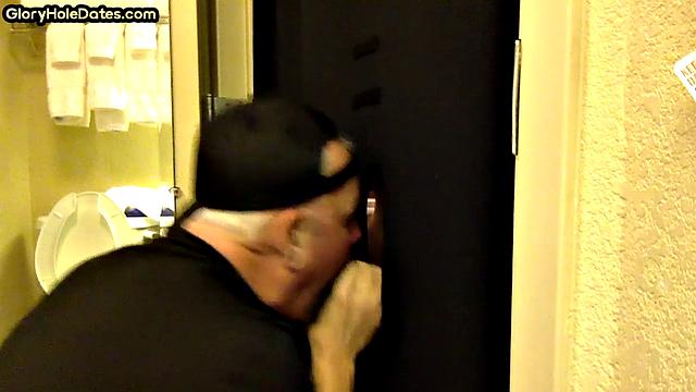 Gloryhole DILF sucks cock with eager mouth near toilet