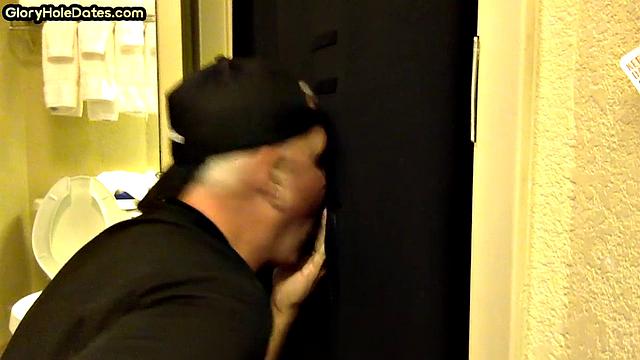 Gloryhole DILF sucks cock with eager mouth near toilet