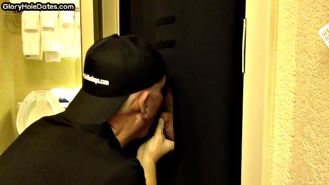 Gloryhole DILF sucks cock with eager mouth near toilet
