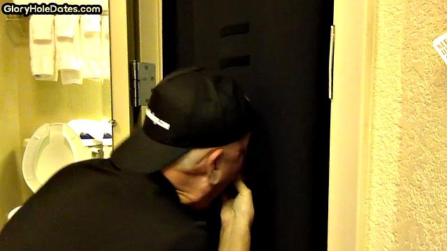 Gloryhole DILF sucks cock with eager mouth near toilet