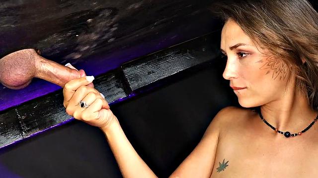 Cute babe wanking BF's cock on gloryhole