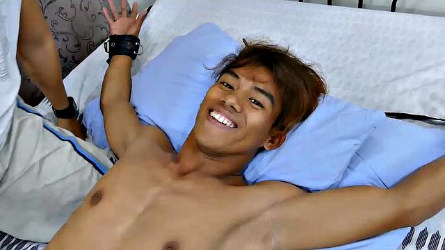 This cute, sexy Asian boy had been in my crosshairs for over a year. Rizal has the most perfect Asian boy feet I've ever seen. I finally got him into my tickling lair for a nice long tickle fetish video.