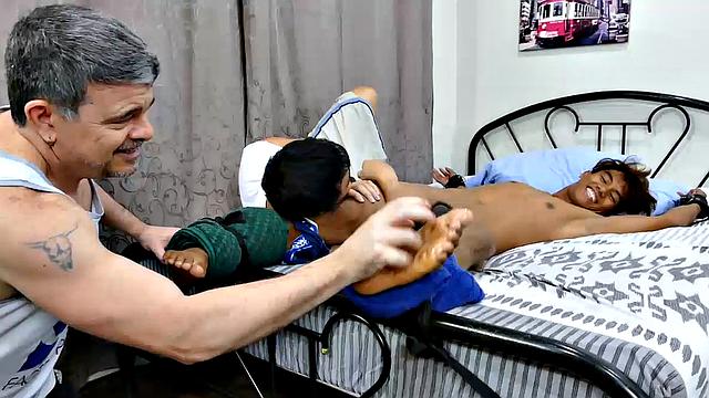 This cute, sexy Asian boy had been in my crosshairs for over a year. Rizal has the most perfect Asian boy feet I've ever seen. I finally got him into my tickling lair for a nice long tickle fetish video.