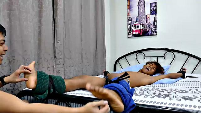 This cute, sexy Asian boy had been in my crosshairs for over a year. Rizal has the most perfect Asian boy feet I've ever seen. I finally got him into my tickling lair for a nice long tickle fetish video.