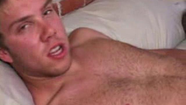 Caleb Lewis is already at work on his cock, as he pulls off his pants. He fingers his butt as he strokes, and in no time he pumps out a wad which he quickly eats up.