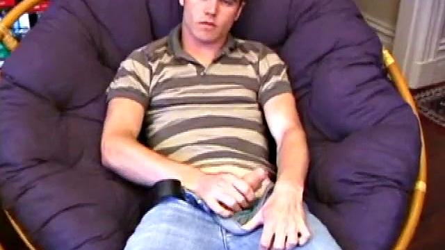 Austin pulls down his jeans, while watching a porn video, and gets his dick hard