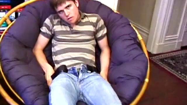 Austin pulls down his jeans, while watching a porn video, and gets his dick hard